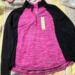 A magenta and black quarter zip.